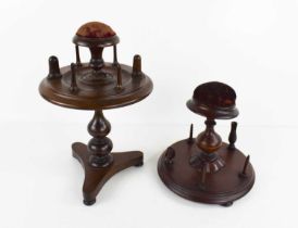 Two Victorian work / bobbin stands, one rosewood example, with rotating bobbin holder centred by the