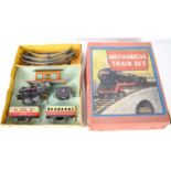 A vintage mechanical tin plate train set, British made, with Pullman carriages, locomotive,