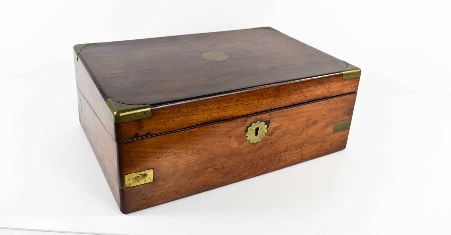 A 19th century rosewood and brass inlaid work box, the lid opens to reveal a leather clad work