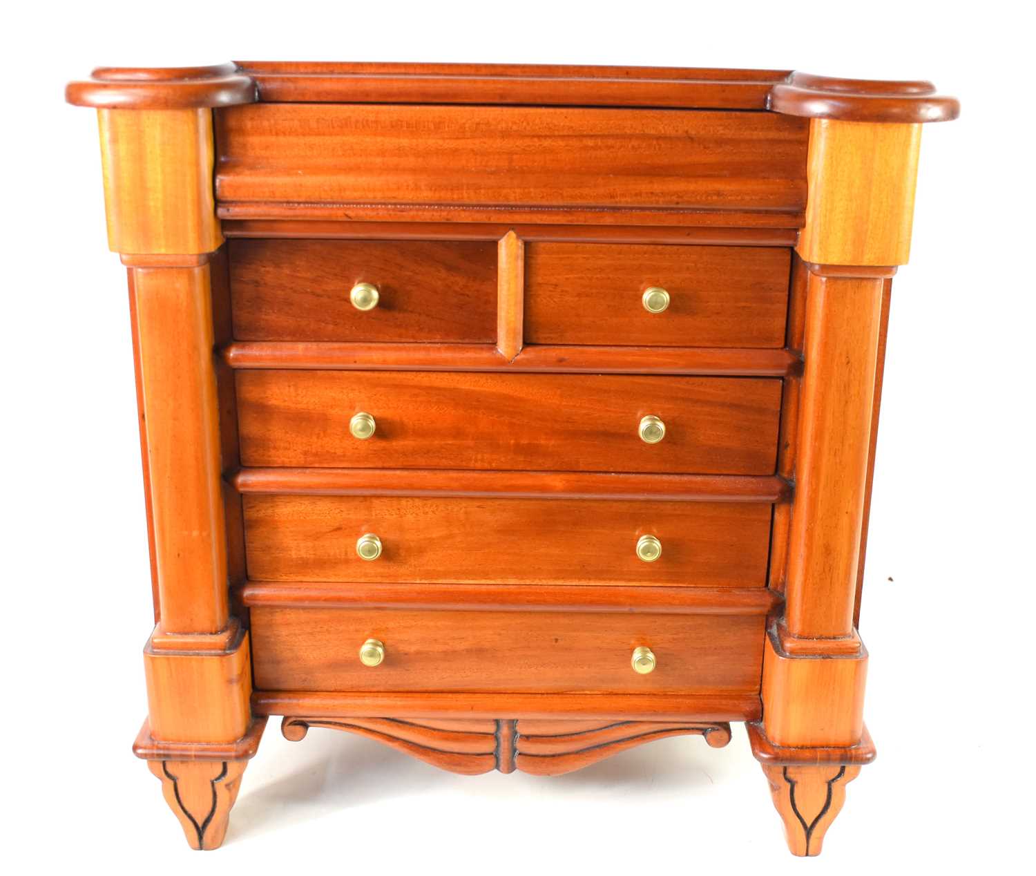 A late Victorian apprentice piece Scottish chest of drawers in solid mahogany, the single ogee