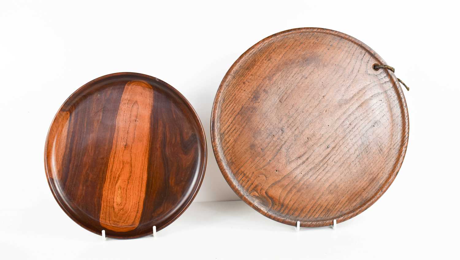 A 19th century or earlier lignum vitae wine salver, 22cm diameter, together with an 18th century oak