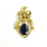 An 18ct gold diamond and sapphire pendant, the oval sapphire of approximately 10.8 by 8.5mm,