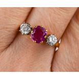 A 9ct gold, diamond and pink sapphire ring, the central sapphire approximately 1ct, the flanking