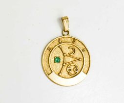 A 9ct gold astrological pendant, set with a green cabochon, 22.5mm diameter, 3.1g.