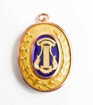 A 9ct gold & enamel oval Masonic pendant, engraved verso 'Presented to Wor Bro A Winterbotham