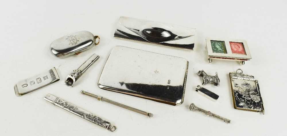 A group of silver accessories including a card case, a small spectacle case, a double stamp box, a