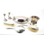A silver backed dressing table set comprising brush, mirror and clothes brush, together with two