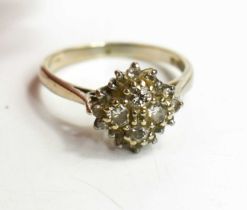 An 18ct gold and diamond cluster ring, set with four old cut diamonds to the centre, each