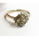 An 18ct gold and diamond cluster ring, set with four old cut diamonds to the centre, each