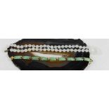 A white jade bead necklace, 50cm long, 37.8g, and a jade and silver gilt bracelet, 18cm long, 14.