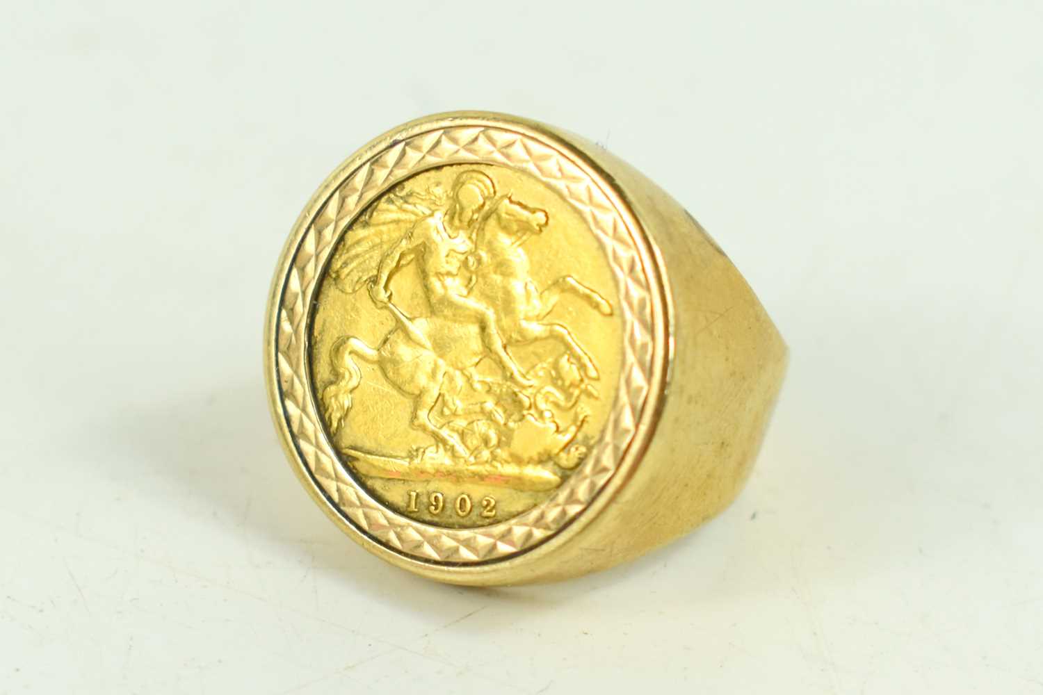 An Edward VII, gold half sovereign, 1902, in 9ct gold ring mount with glass back, size K/L, total