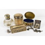 A group of silver to include a silver footed trinket box with repousse finish, a silver thimble,