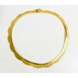 An 18ct gold necklace, composed of undulating fronds, with sliding clasp and safety link, with