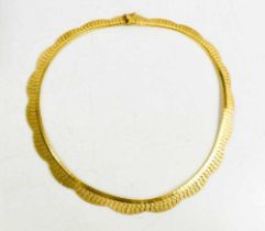 An 18ct gold necklace, composed of undulating fronds, with sliding clasp and safety link, with