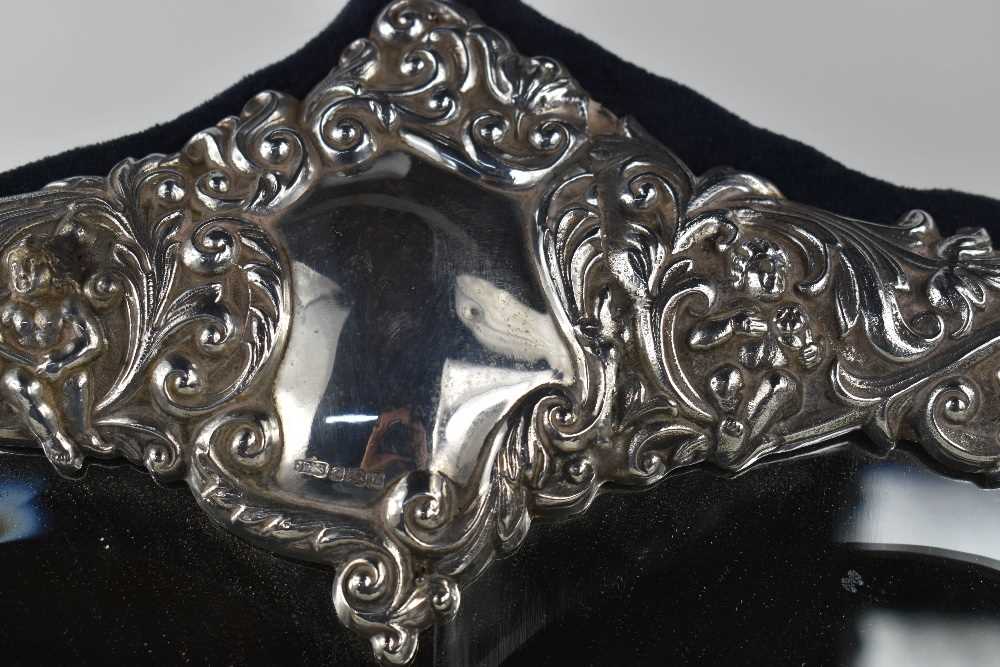 A fine & impressive silver heart form mirror, Sheffield 1995, the silver border embossed profusely - Image 3 of 5