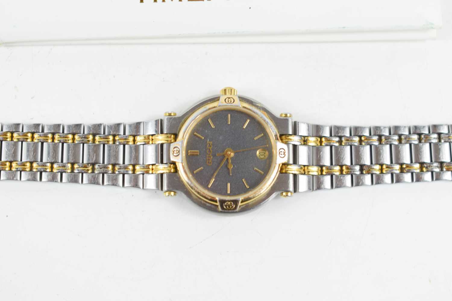 A lady's Gucci wristwatch, the signed black dial with baton numerals, date aperture at 6 o'clock, - Image 2 of 2