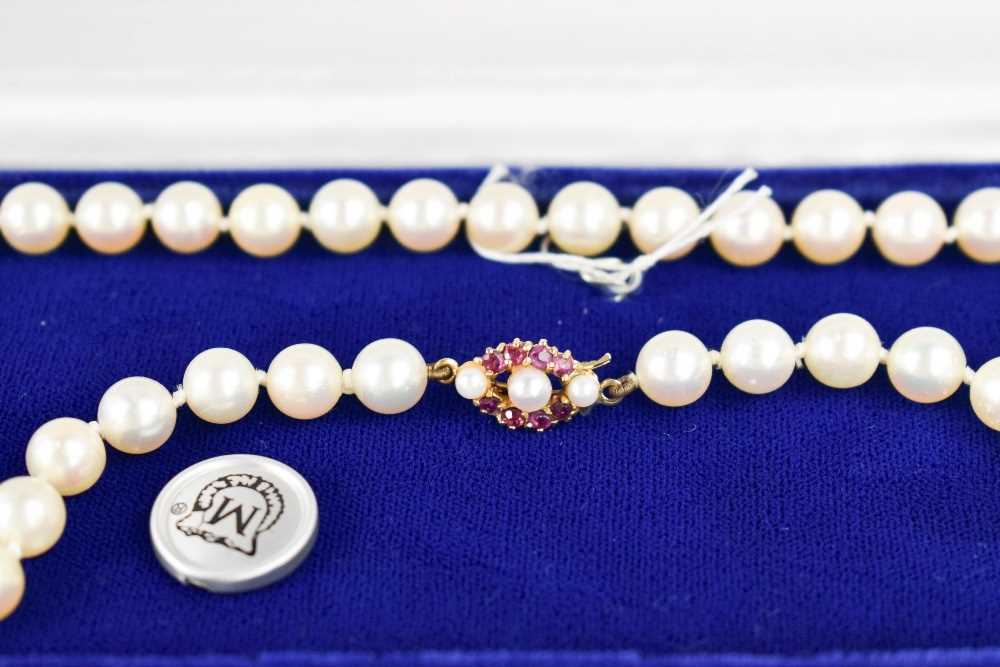 A Mikimoto pearl necklace, with a 9ct gold, pearl and pink sapphire set clasp, bearing makers - Image 4 of 4