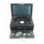 A vintage leather clad jewellery box together with a group of vintage jewellery to include a