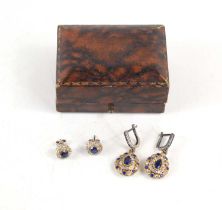 A pair of sapphire and diamond earrings, each set with a central sapphire, approximately 4.4mm