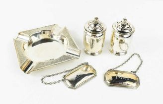 A group of silver to a silver salt and pepper, a silver machine engraved ashtray, and a pair of
