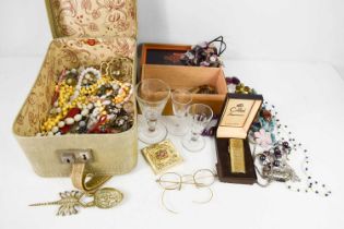 A collection of vintage costume jewellery including coloured beads, shells, faux pearls, paste,