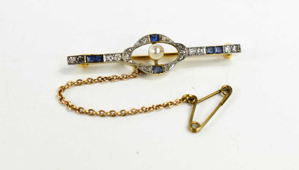 An Art Deco 18ct gold, diamond and sapphire brooch, with a central pearl, safety chain and gold pin,