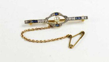 An Art Deco 18ct gold, diamond and sapphire brooch, with a central pearl, safety chain and gold pin,