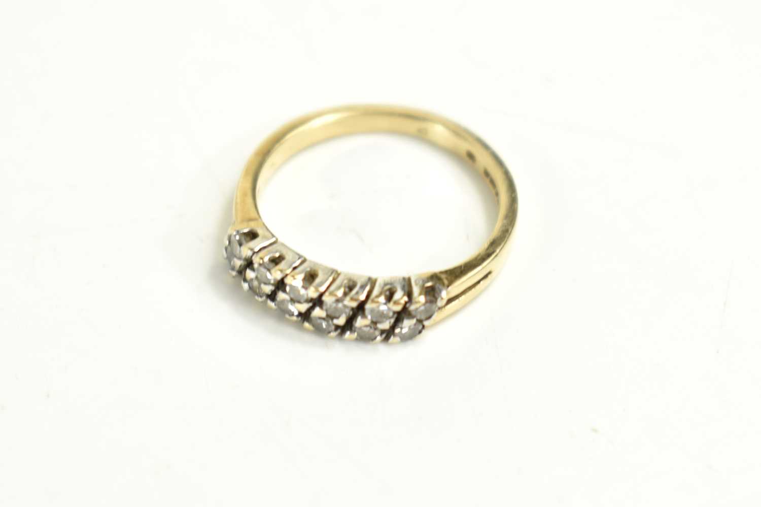 A 9ct gold and diamond twelve stone ring, the diamond brilliants set in six diagonal pairs, size - Image 2 of 2