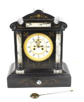 A French slate and marble mantle clock, carved floral decoration, visible escapement, with pendulum,