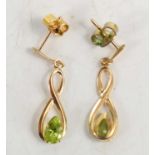 A pair of 9ct gold and peridot drop earrings.