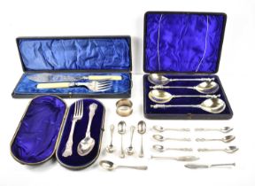 A Victorian cased silver Christening set together with a set of white metal apostle spoons, fish