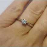 A platinum diamond solitaire ring, in a four claw setting, the brilliant cut diamond 0.35cts, colour
