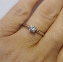 A platinum diamond solitaire ring, in a four claw setting, the brilliant cut diamond 0.35cts, colour