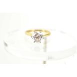 An 18ct gold, platinum and diamond solitaire ring, the diamond of approximately 1.5ct, 7.3mm