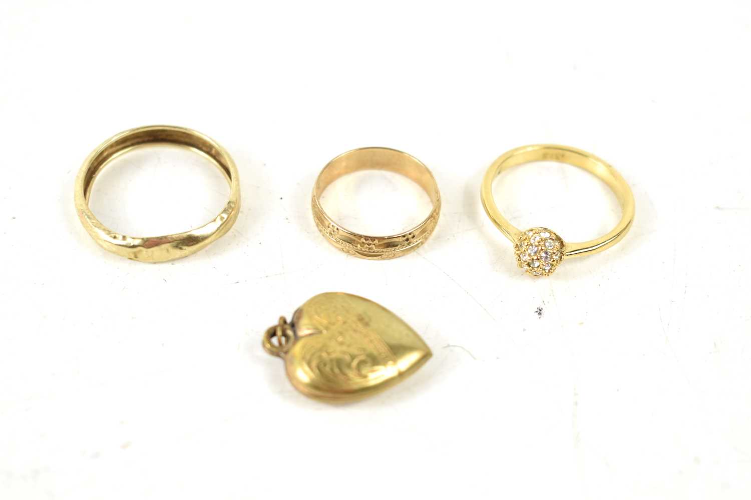 Three 9ct gold rings, one set with white stones, 3.9g, together with an 18ct gold front and back