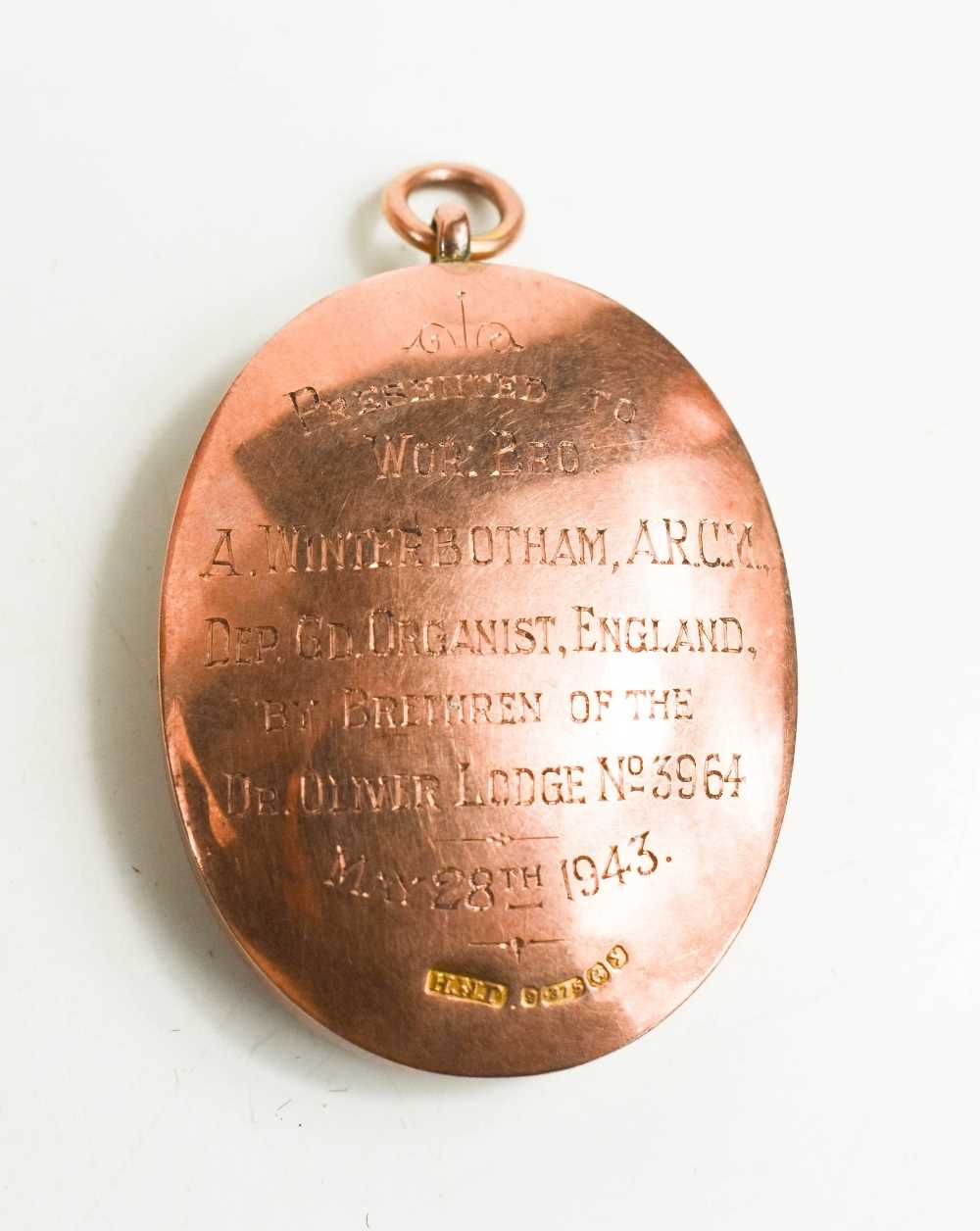 A 9ct gold & enamel oval Masonic pendant, engraved verso 'Presented to Wor Bro A Winterbotham - Image 2 of 2