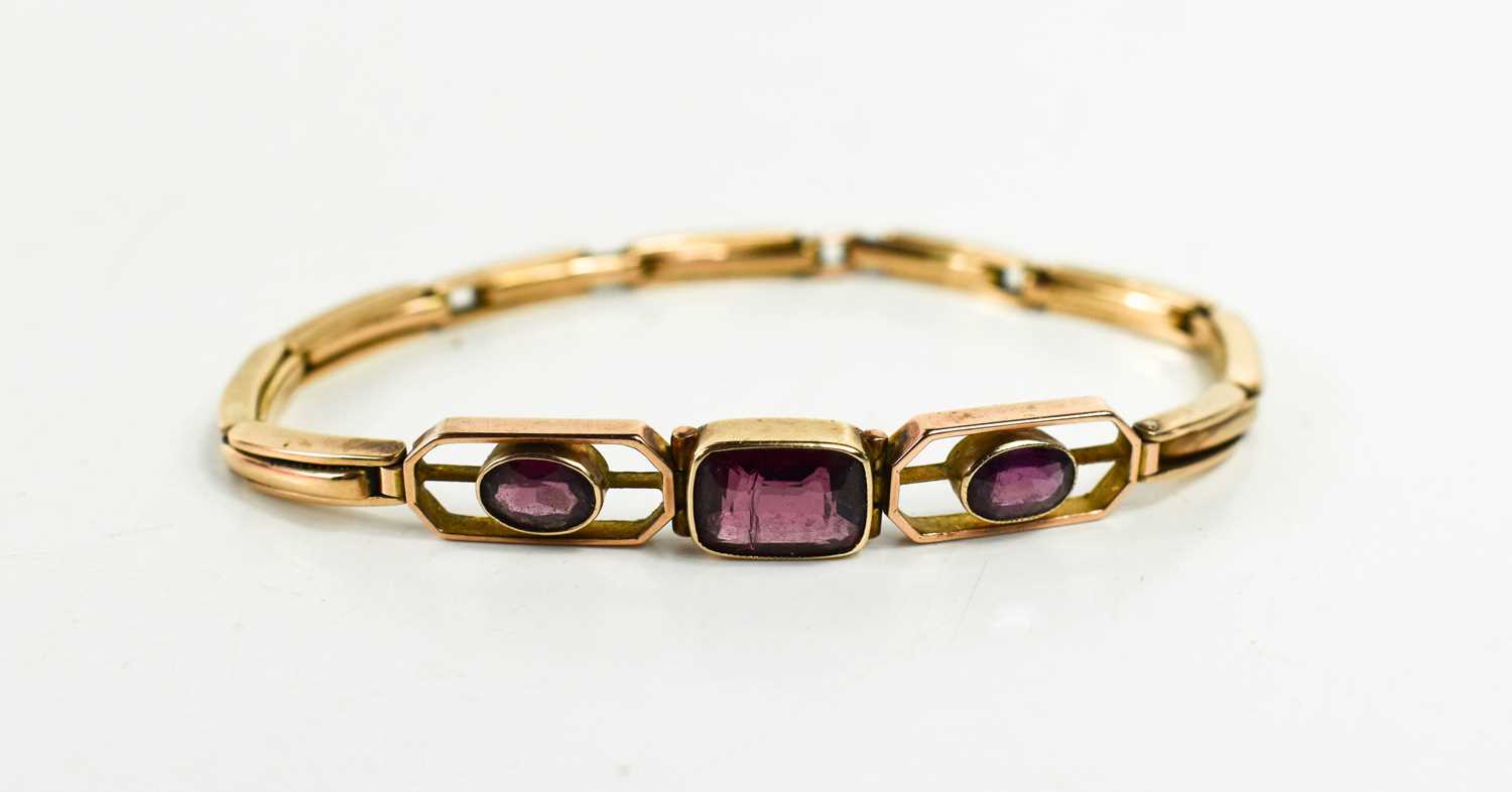 A 9ct rose gold bracelet set with three amethysts, the central emerald cut amethyst of approximately - Image 2 of 2