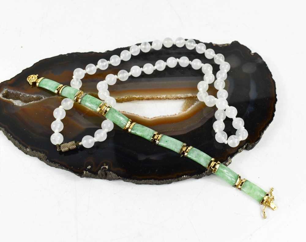 A white jade bead necklace, 50cm long, 37.8g, and a jade and silver gilt bracelet, 18cm long, 14. - Image 2 of 2