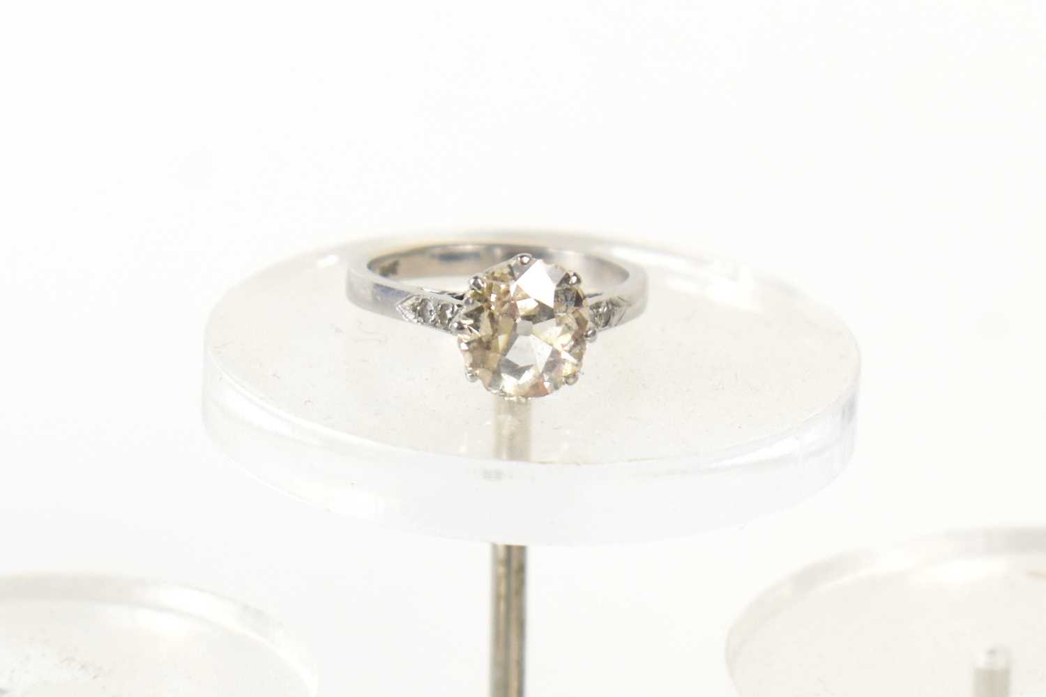 An old brilliant cut solitaire diamond and platinum ring, the diamond of very slightly uneven