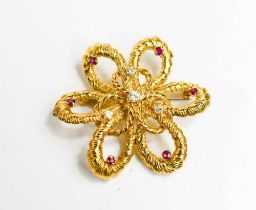 A gold (testing as at least 14ct) diamond and pink sapphire set flower head form brooch, with