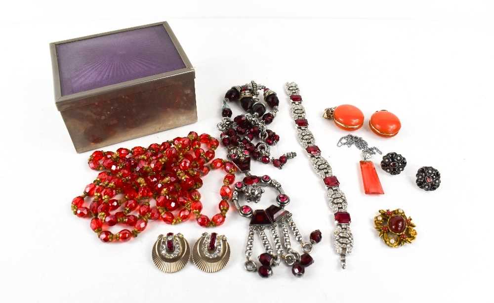 A group of Art Deco and later costume jewellery in red tones, including a tangerine orange