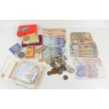 A group of coins and banknotes to include commemorative crowns, British and India banknotes and