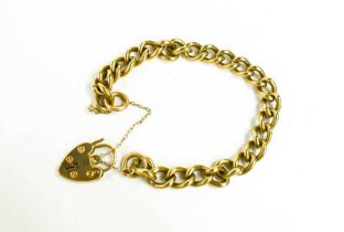 A 9ct gold curb link charm bracelet with heart shaped padlock clasp, 33.6g.