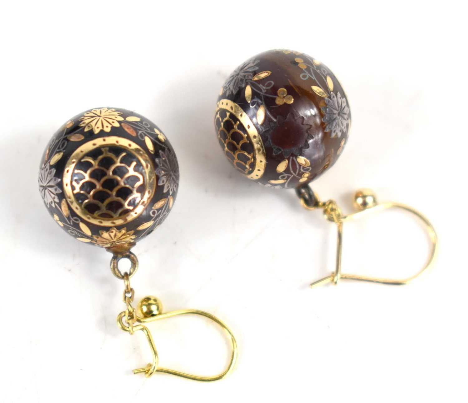 A pair of early 19th century gold ball earrings, the ball drops inlaid with gold flowers, and fish - Image 2 of 2