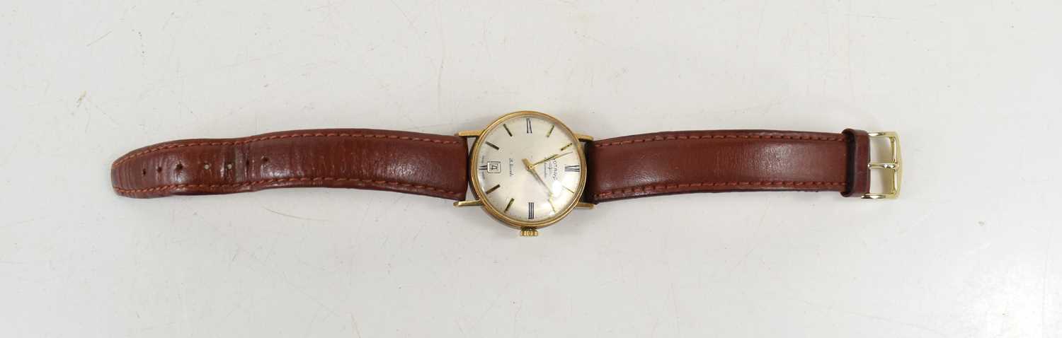 A gentleman's vintage, 9ct gold cased, Rotary Automatic wristwatch, the champagne dial with baton