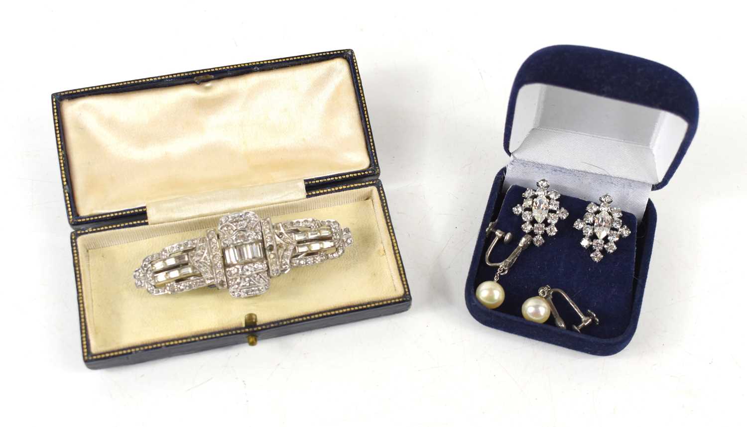 An Art Deco metamorphic dress brooch, inbuilt with a small glass perfume vial, both contained in a