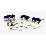 A group of silver items comprising a pair of salts, with pierced foliate decoration, a single