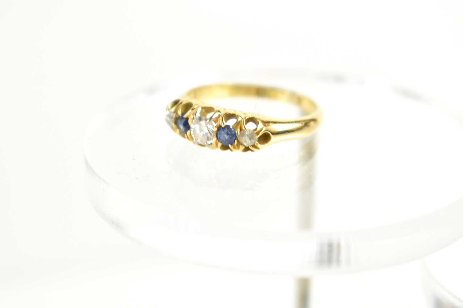 An 18ct gold, diamond and sapphire five stone ring, the central, largest diamond of approximately - Image 2 of 3