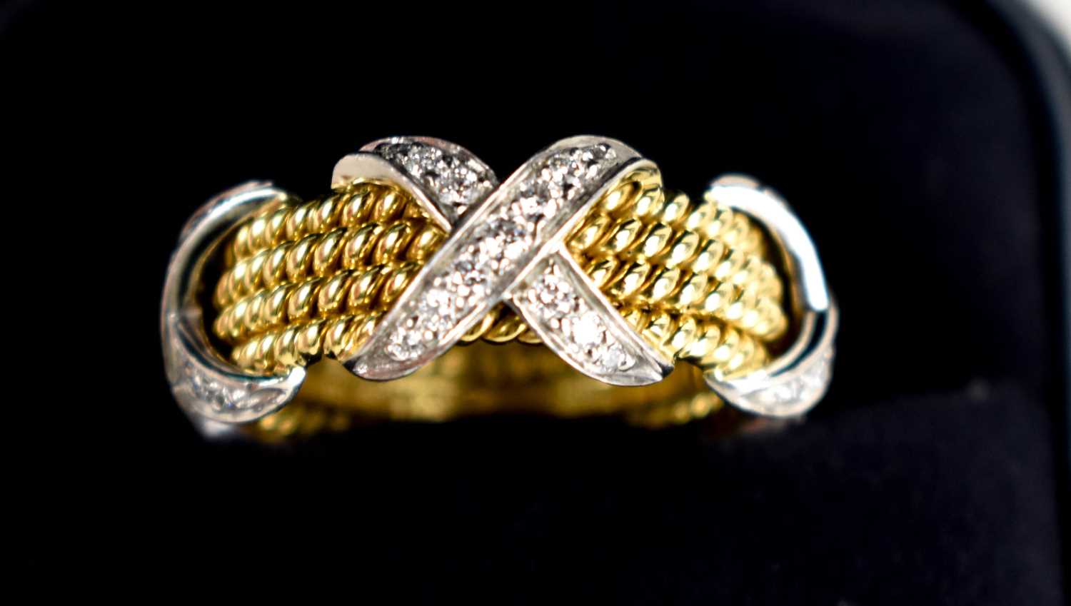A Tiffany & Co by Schlumberger Studios 18ct gold and diamond ring, composed of four yellow gold
