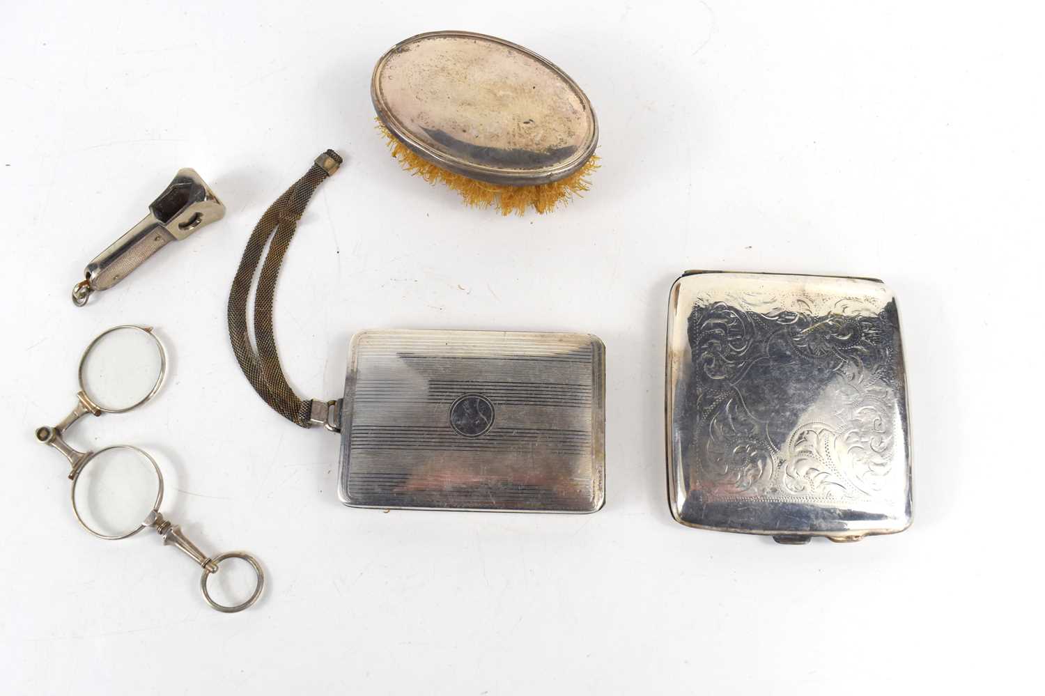A group of silver items including a cigar cutter, S. J. Rose and Son, Birmingham 1959, a silver